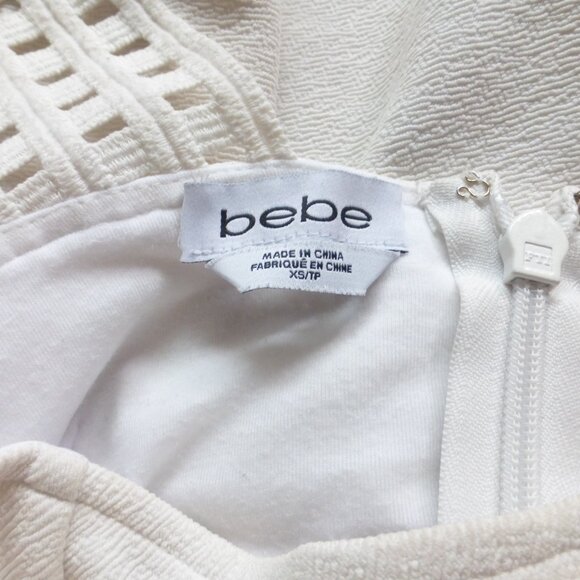 BEBE white peplum top with thick straps and small cut out details - Picture 13 of 13